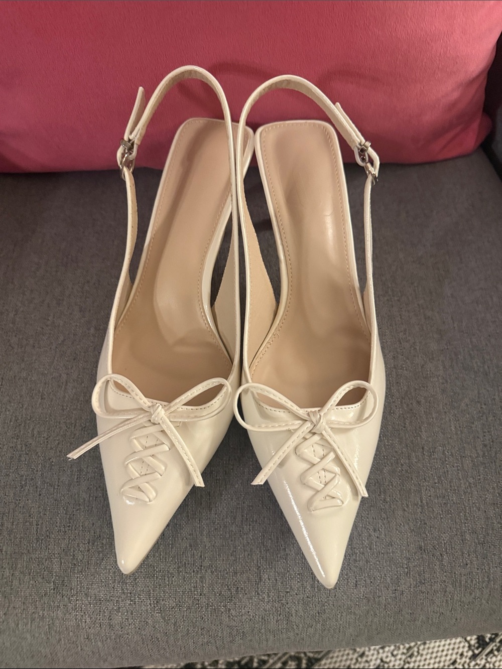 Patent Pointed-Toe Slingback Heels in Cream with Bow Accent